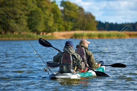 Two anglers paddle the Point 65 Tequila GTX with two fishing rods